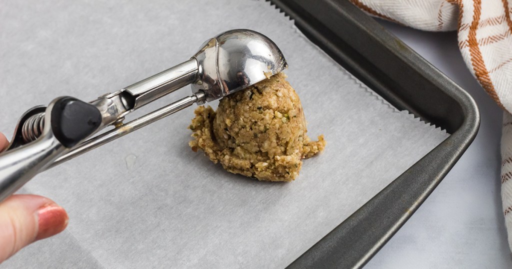 scooping cookie dough onto baking tray