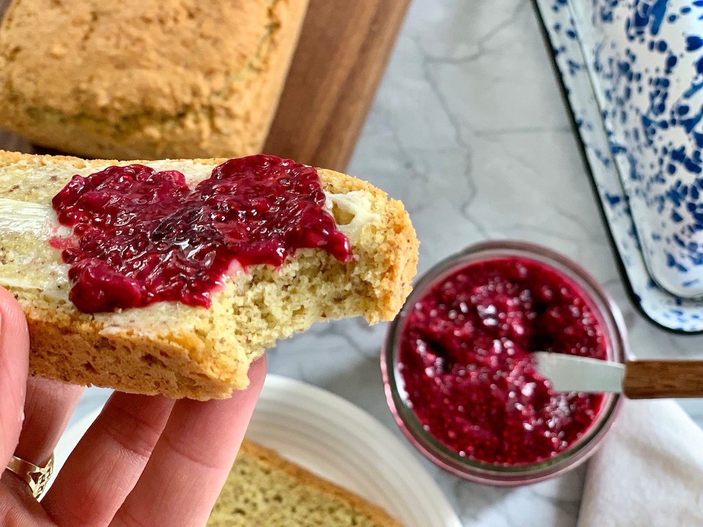 eating keto bread with low carb jam and butter