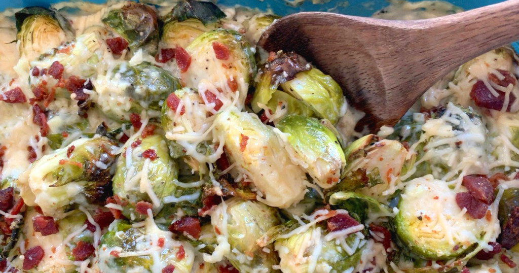 close up of roasted Brussel sprouts in creamy Alfredo sauce with bacon
