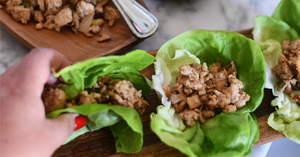 holding a PF Chang's Copycat Lettuce Wrap on a plate