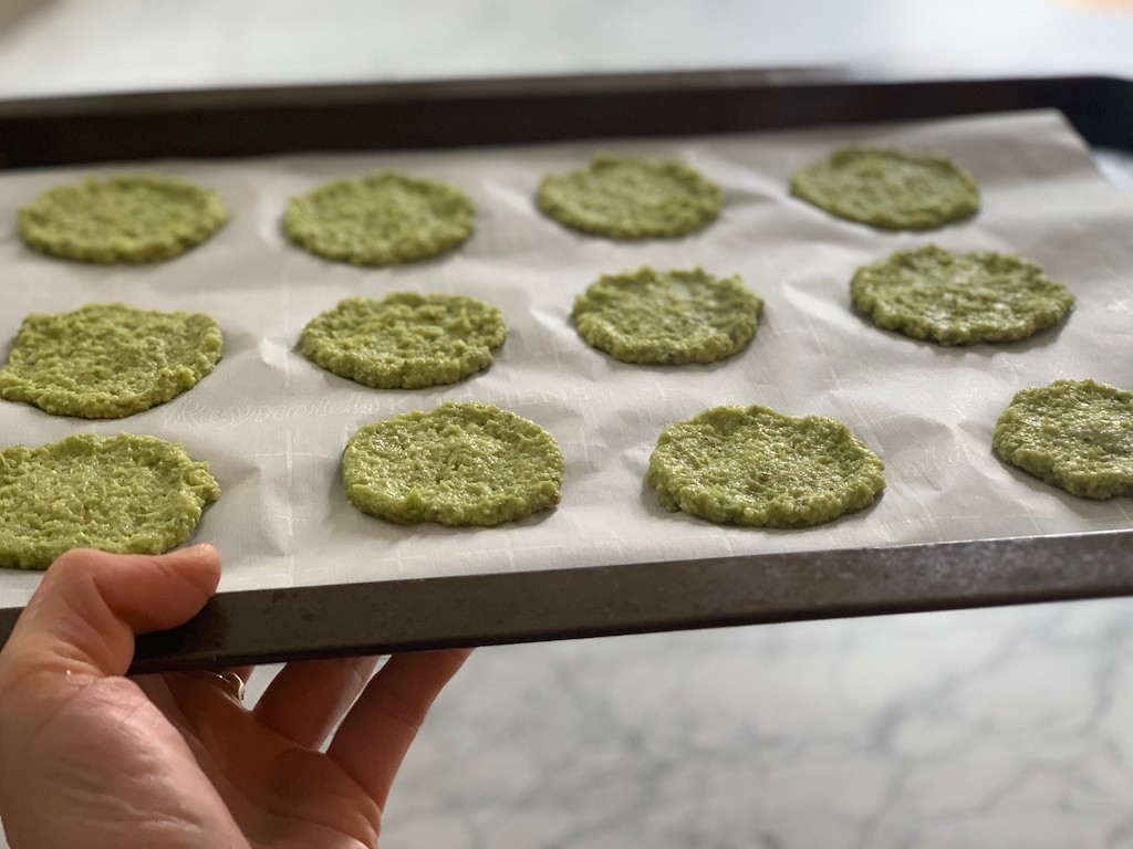 keto avocado chips on pan going into oven