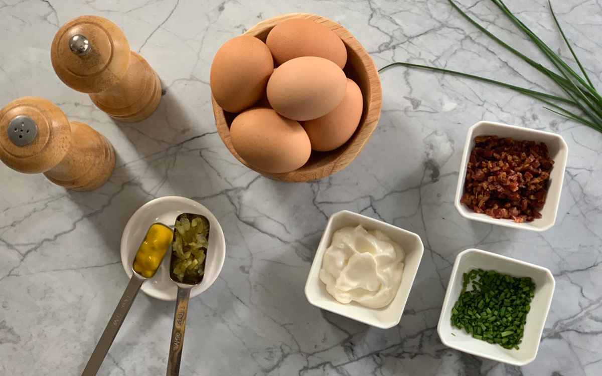 ingredients ready to prepare a batch of bacon deviled eggs