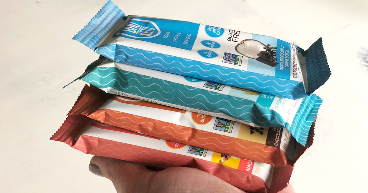 Bhu Keto bars stacked in an open palm