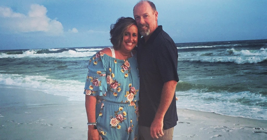 candi and husband on the beach