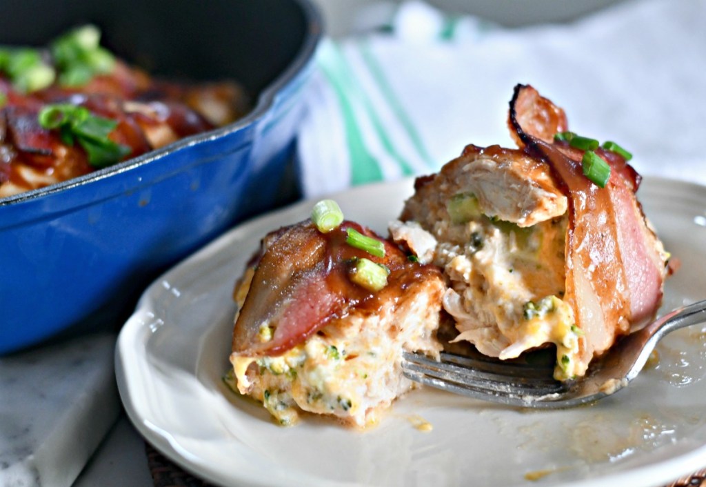 chicken stuffed with cheddar broccoli filling on a plate