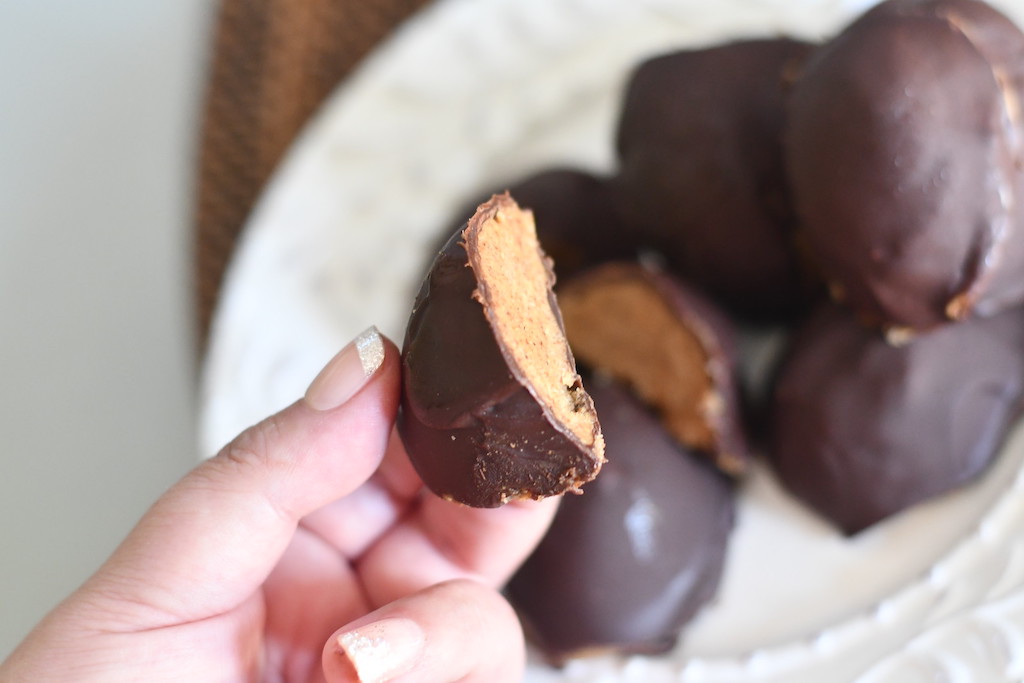 holding chocolate peanut butter egg