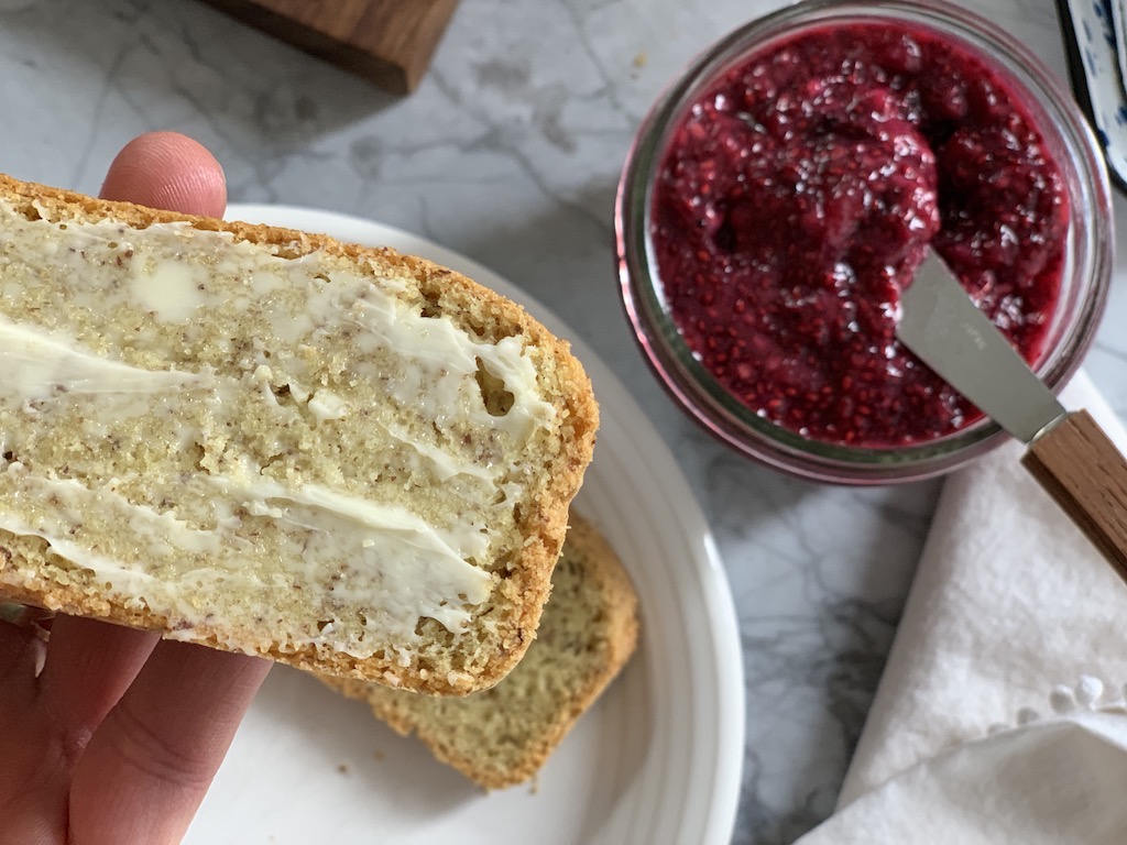 Keto bread slathered with butter and jam