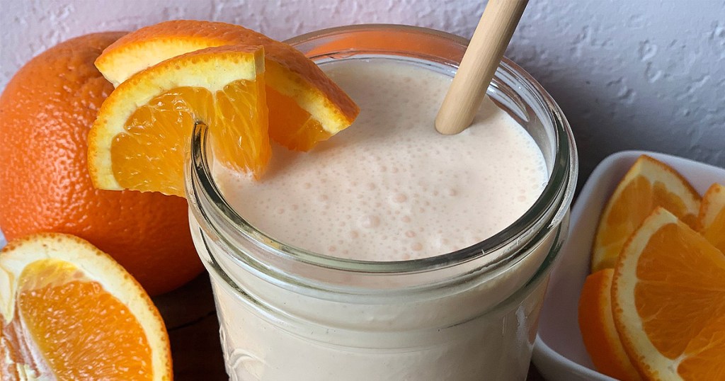 keto orange julius copycat in a jar with oranges