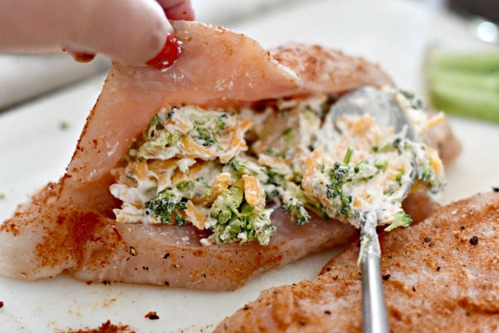 stuffing chicken breast with cheese and broccoli filling 