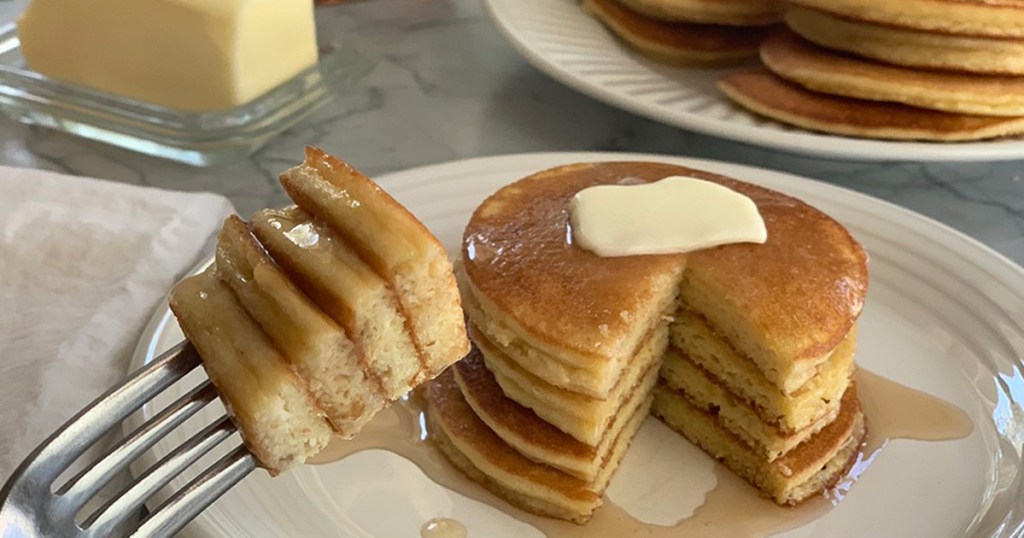 a forkful of keto pancakes with syrup