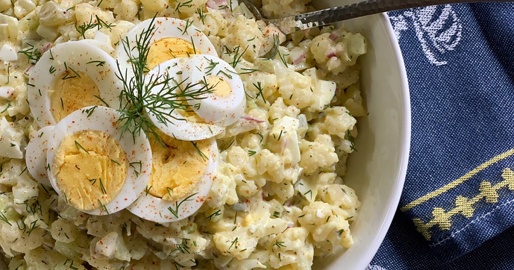 a serving bowl of low-carb mock cauliflower potato salad