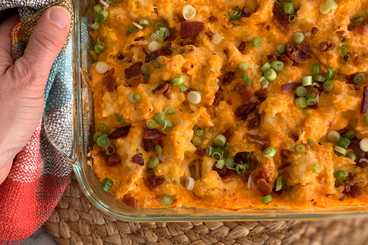 a serving dish with ready to eat low-carb Buffalo chicken casserole