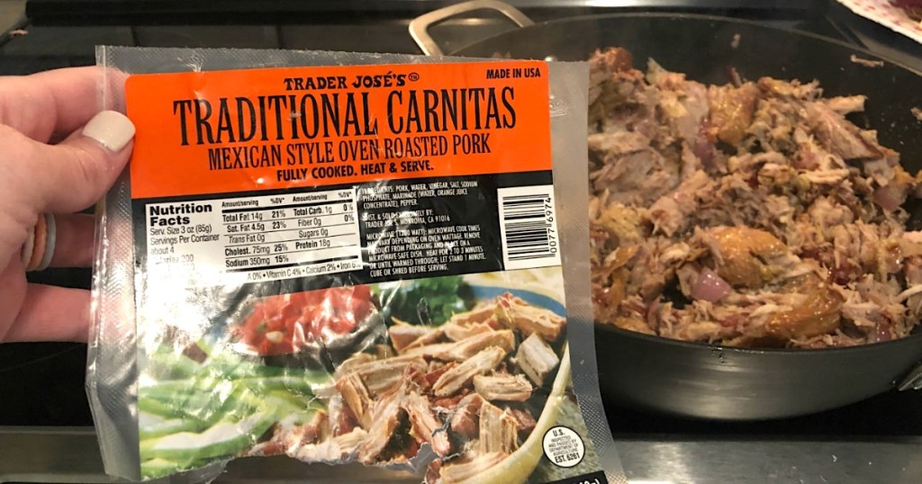 holding Trader Joe's Pork Carnitas bag with pork in pan 