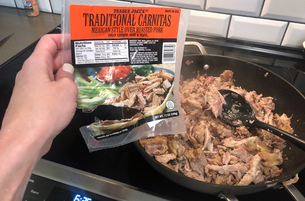 empty package of trader joe's carnitas in front of skillet
