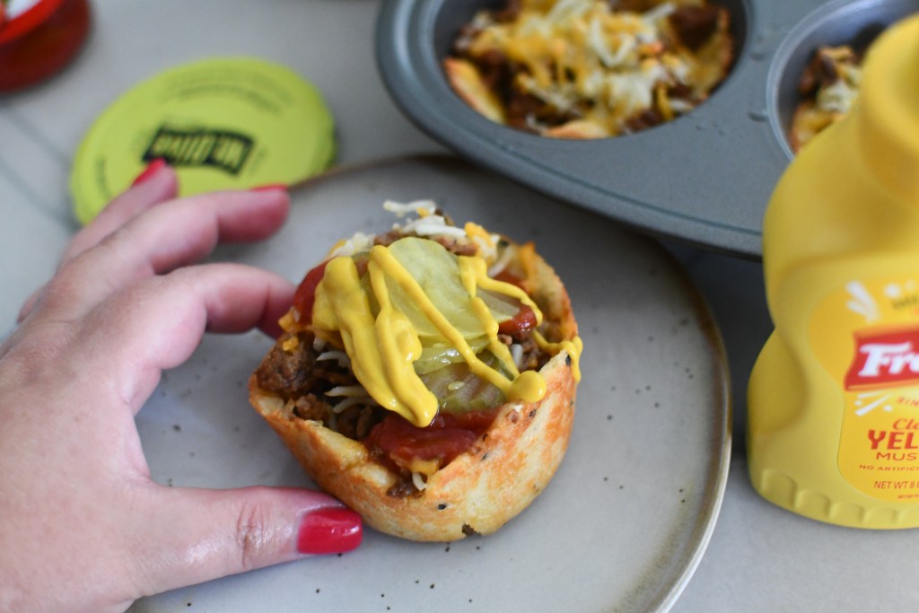 cheeseburger muffin on a plate with condiments 