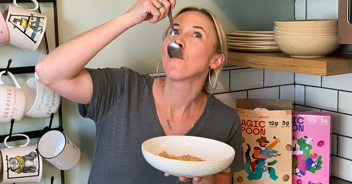 woman eating spoonful of magic spoon cereal