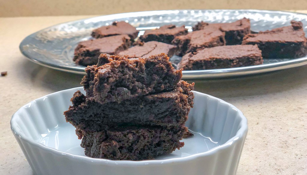 fudgy keto brownies — stack of keto brownies cooled