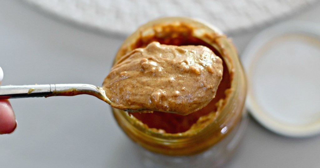 mixed up natural peanut butter with spoon