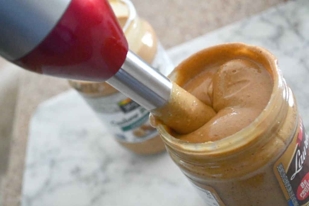 using an immersion blender to mix peanut butter