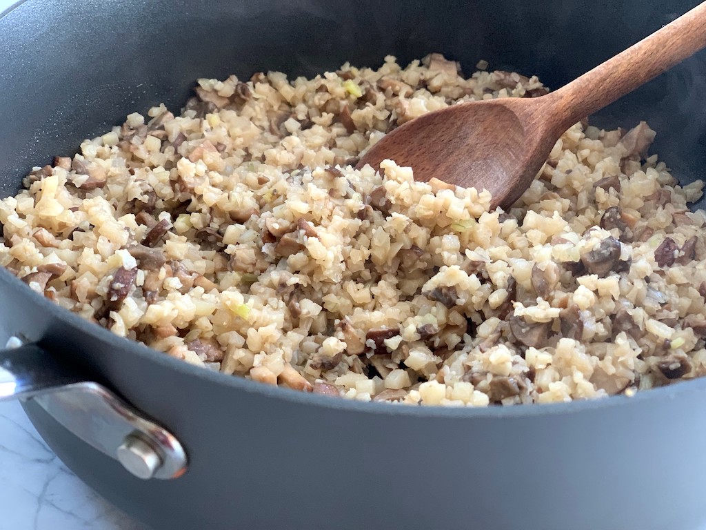 keto veggie burger ingredients in pan with wooden spoon