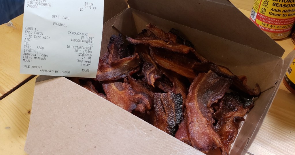 cooked bacon in a Whole Foods to-go box
