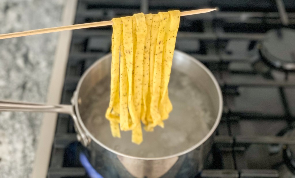 keto pasta over a pot of boiling water