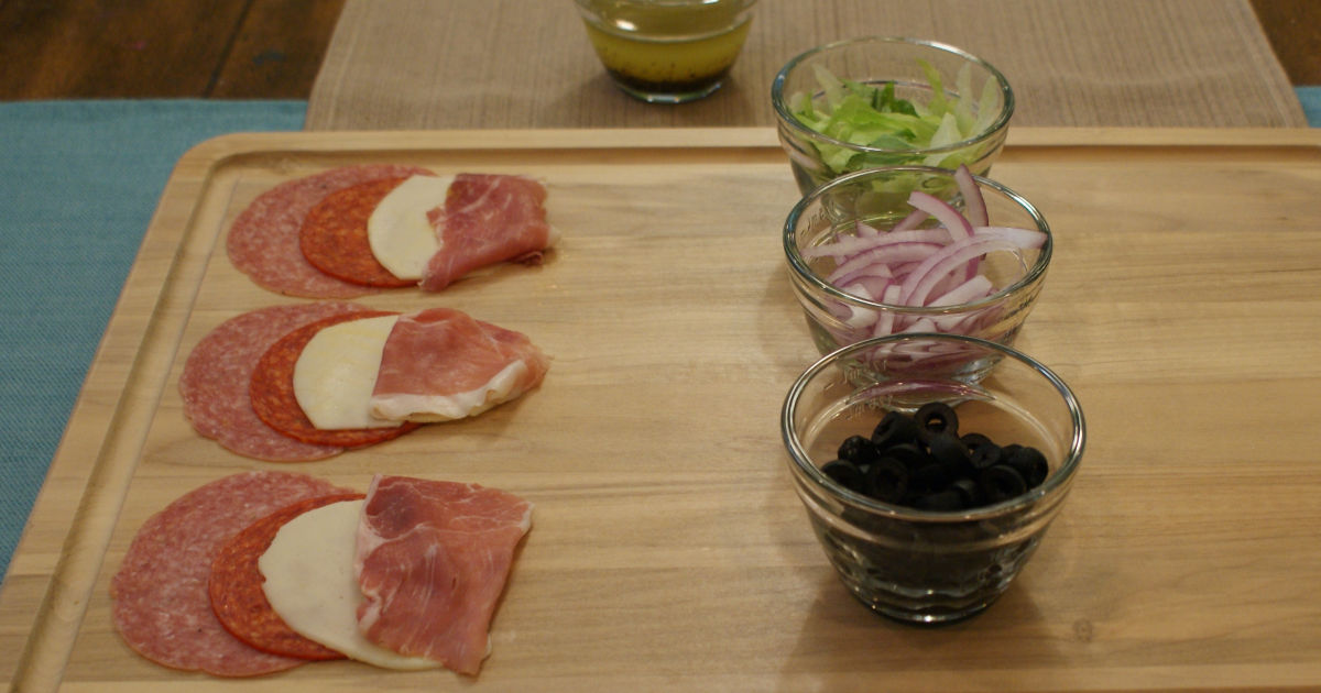 assembling the roll-ups on a cutting board