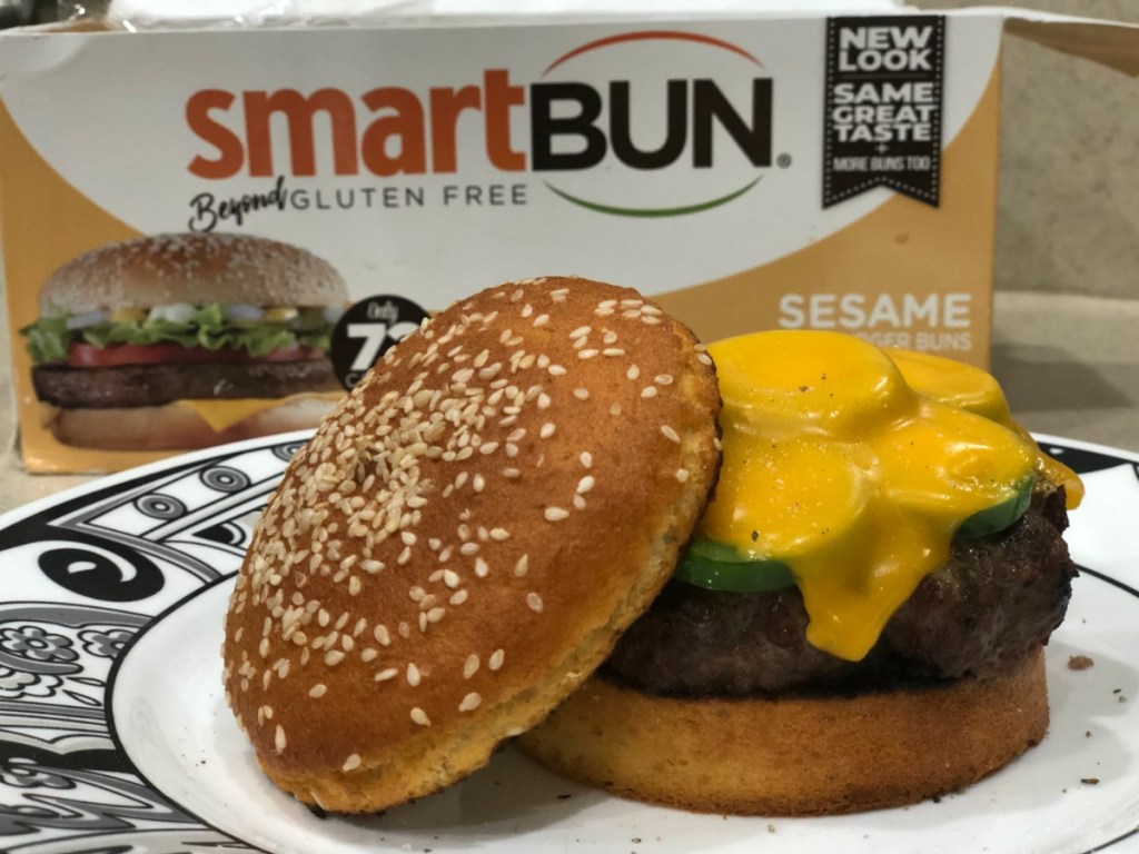 SmartBun package sitting behind cheeseburger on keto sesame bun