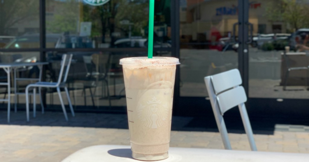 Starbucks Keto Horchata on table with starbucks cinnamon dolce syrup