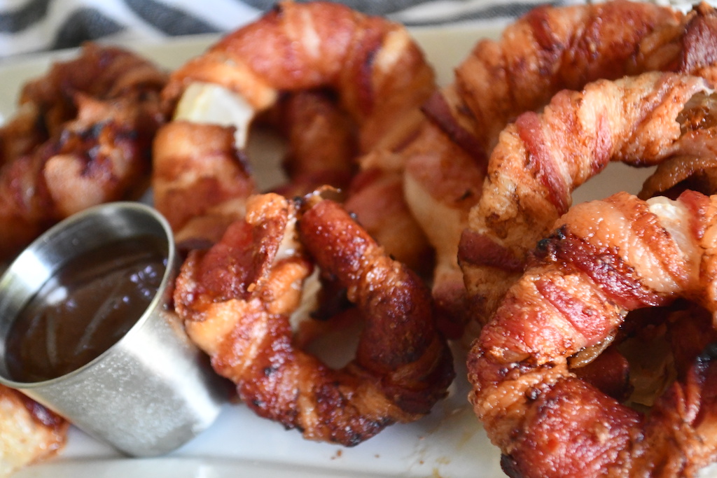 bacon-wrapped onion rings on plate
