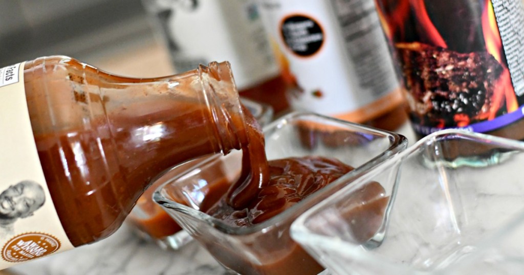 pouring bbq sauce in a small dish 