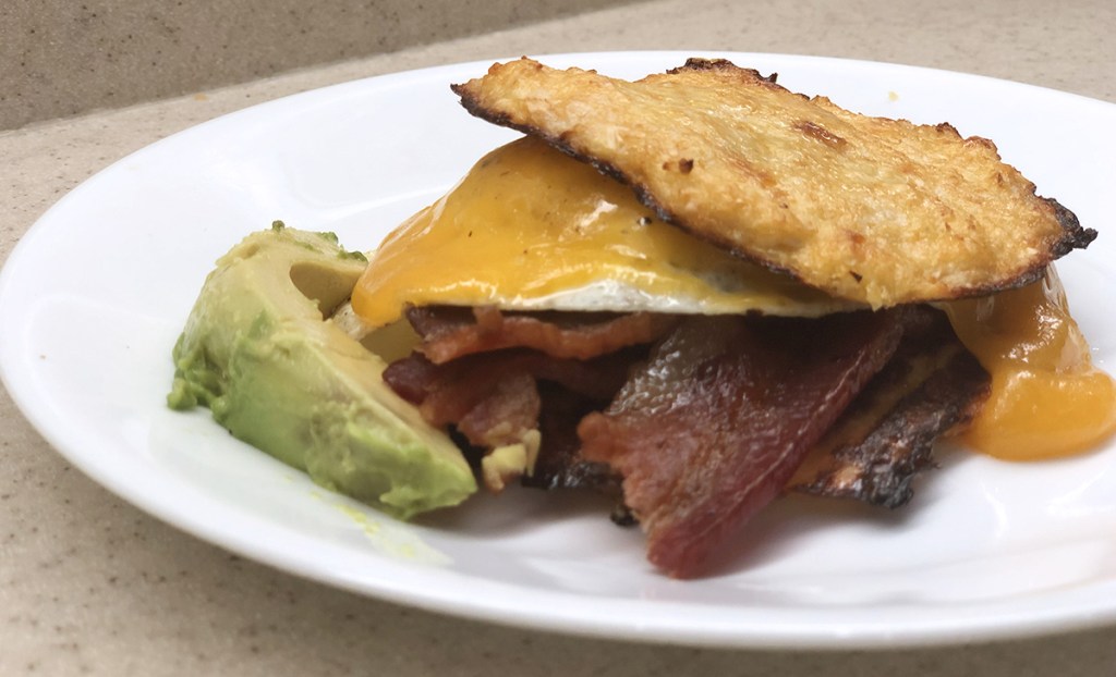 breakfast sandwich made with keto cauliflower english muffins