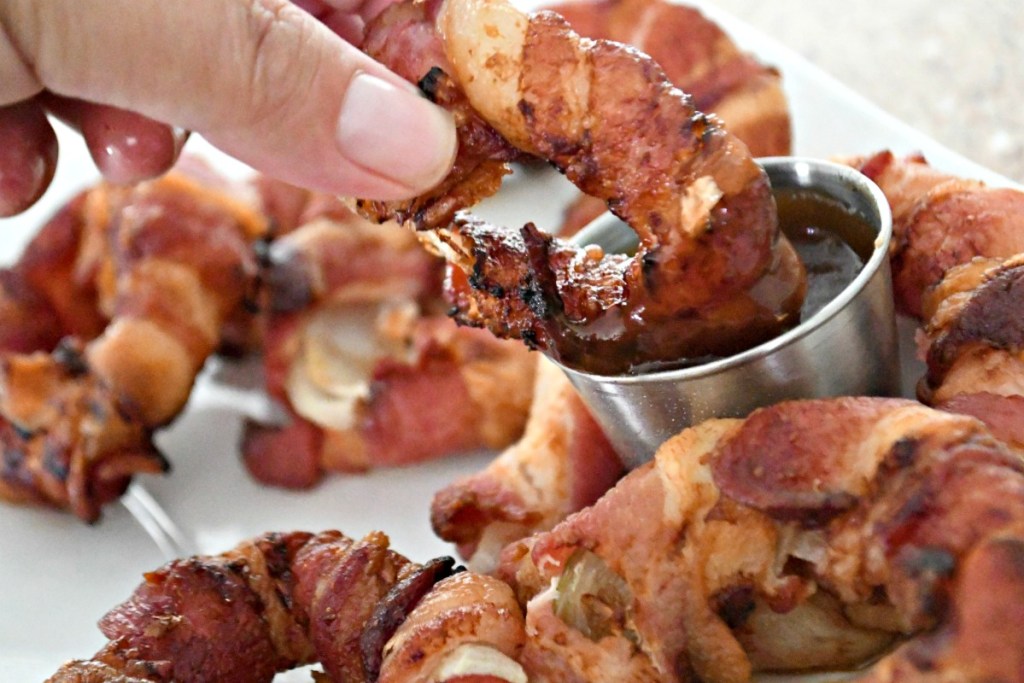 dipping bacon onion rings in sugar free bbq sauce