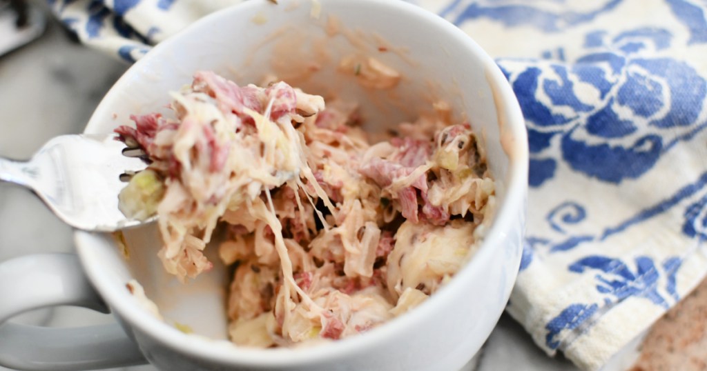 fork in a reuben in a mug