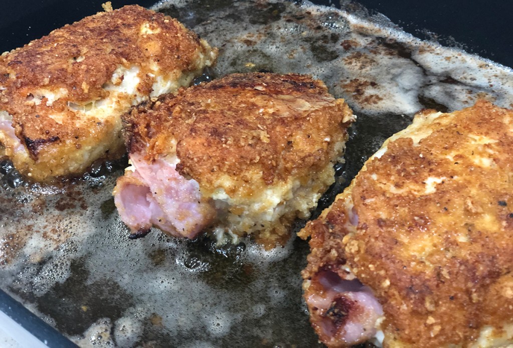 chicken cordon bleu rolls frying