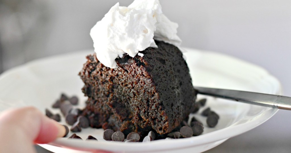 holding a plate with keto chocolate cake