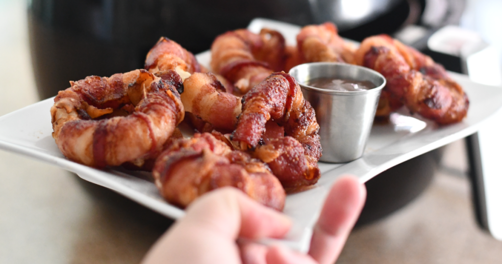 holding plate of bacon onion rings 