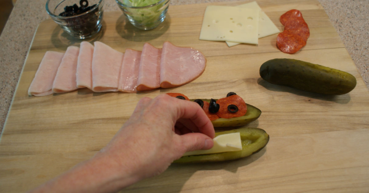 adding cheese to the pickle sandwich recipe