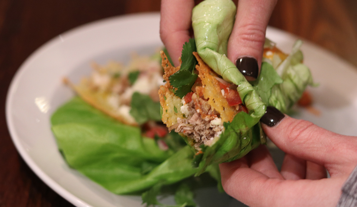 holding lettuce taco wrap for keto tacos