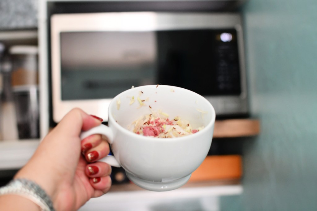 putting keto reuben in a mug in the microwave