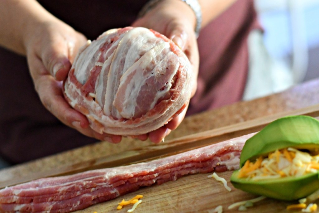 wrapping a burger bacon bomb with bacon