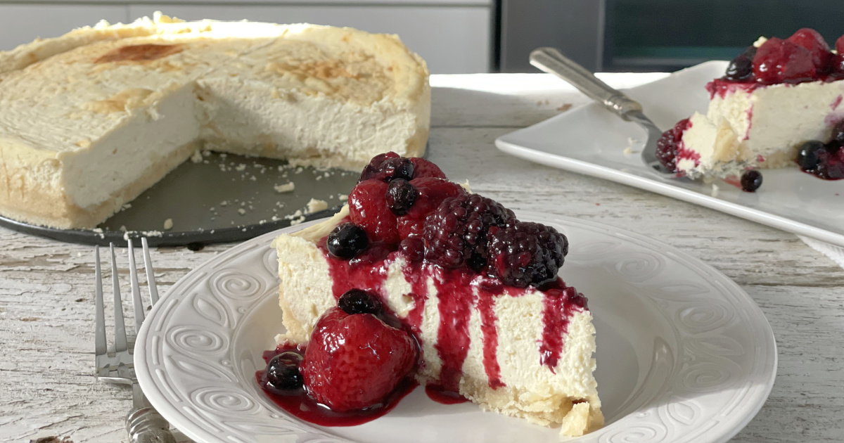 keto cheesecake plated with berries
