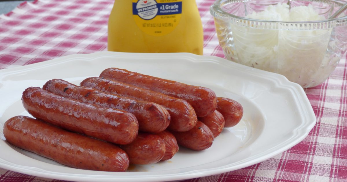 hot dogs with mustard and onions