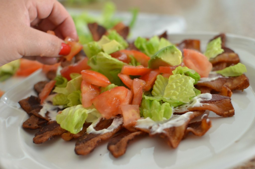 adding tomatoes to blt sushi