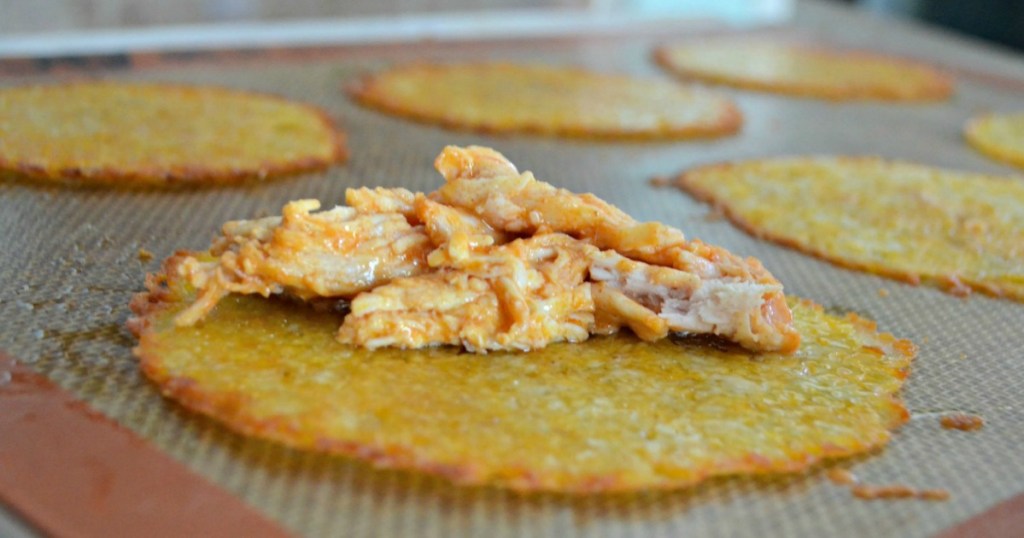 shredded chicken on baked cheese shell 