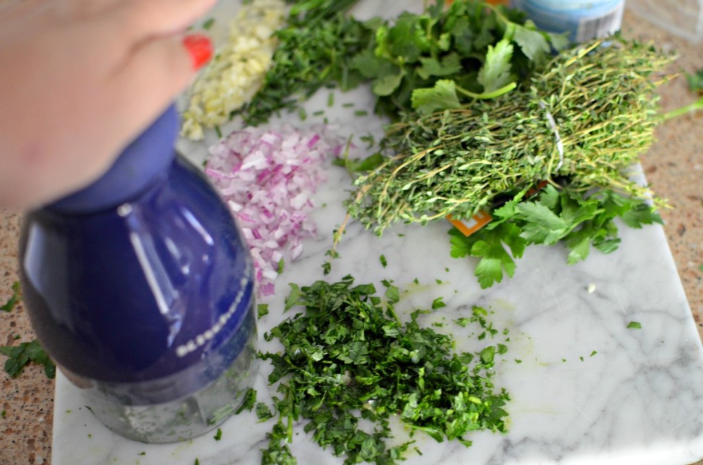 using hand chopper to make chimichurri sauce 