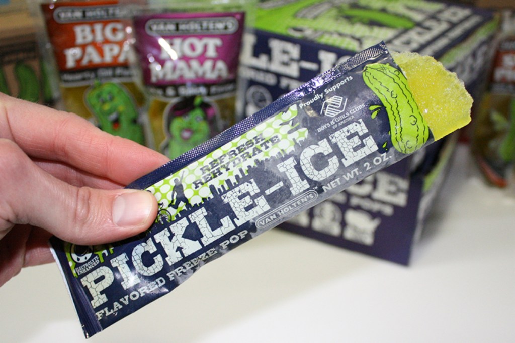 hand holding pickle ice pop