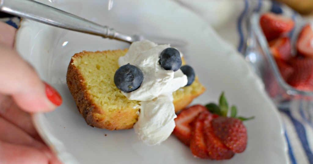 slice of cream cheese keto pound cake with whipped cream