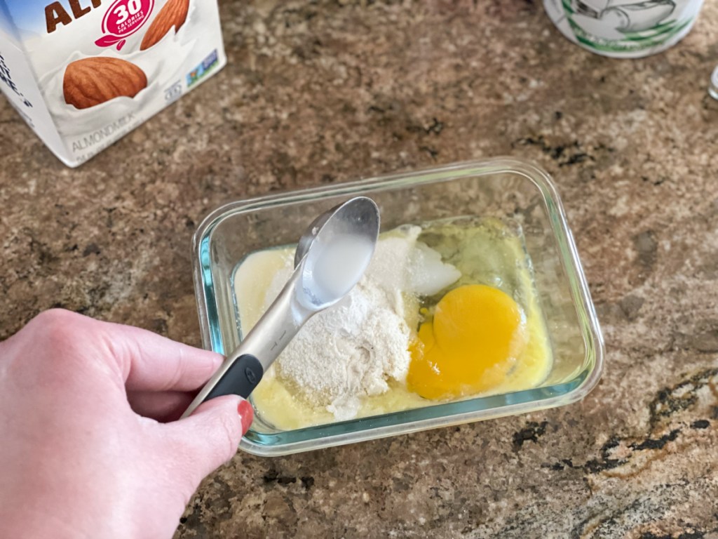 adding almond milk to a dish