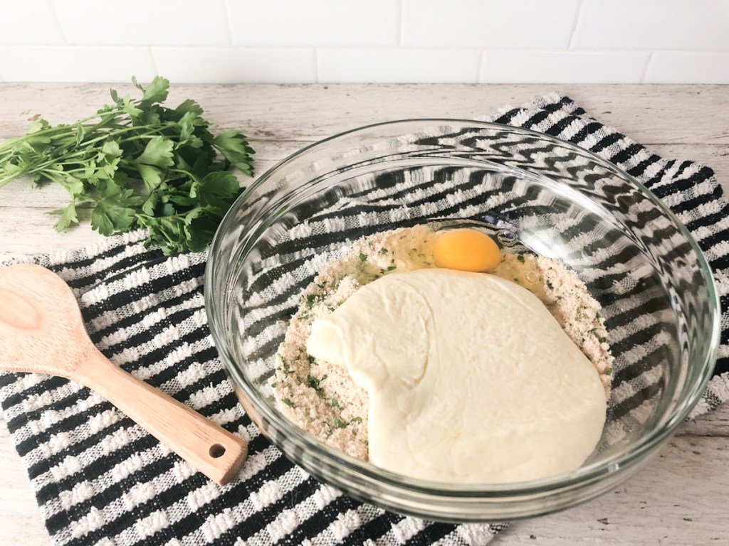 cheese dough, egg, and dry ingredients in a bowl